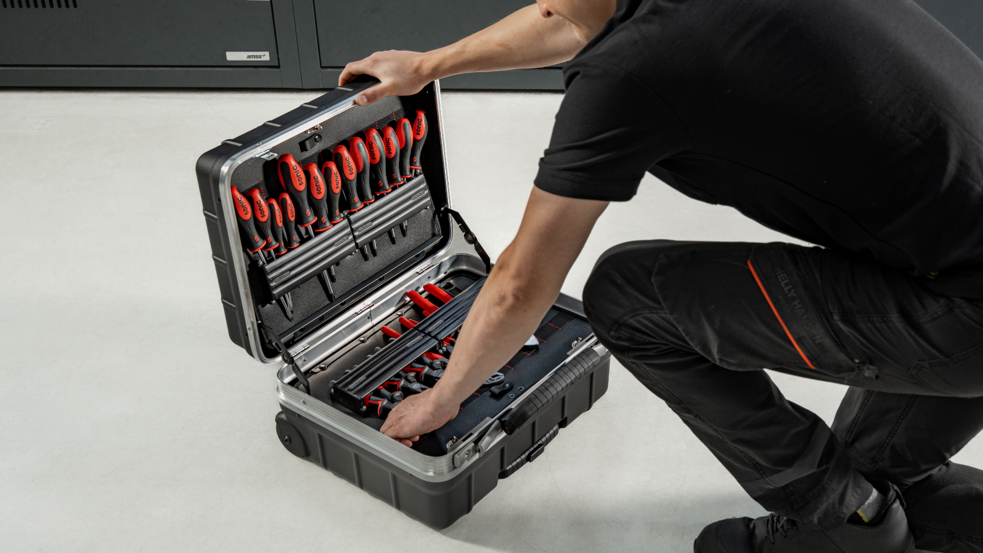 A mechanic with a Sonic tool case